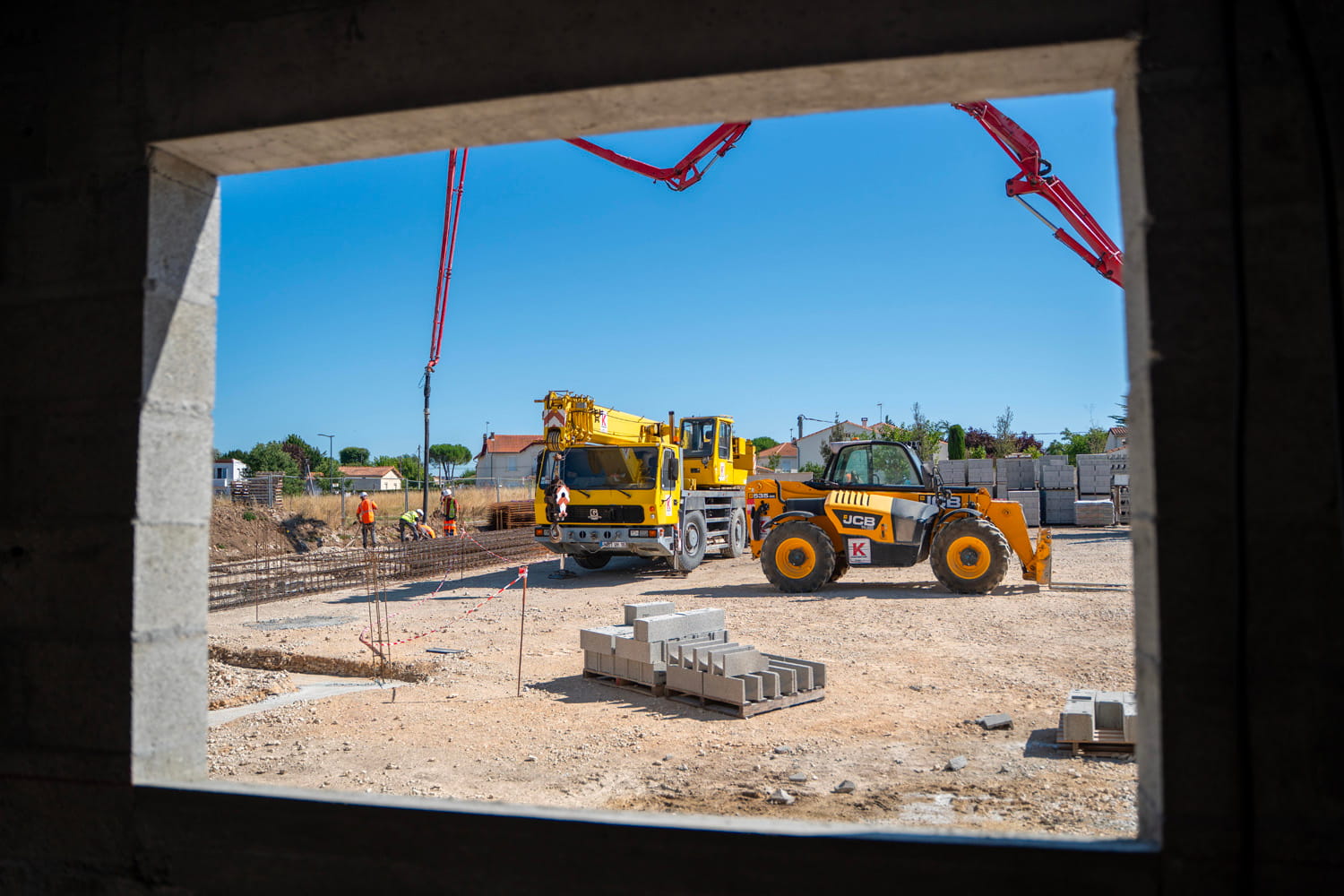 Construction site with crane and workers